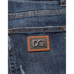 Dolce & Gabbana Dark Blue Washed Running Ripped Denim Jeans with leather logo patch detail.
