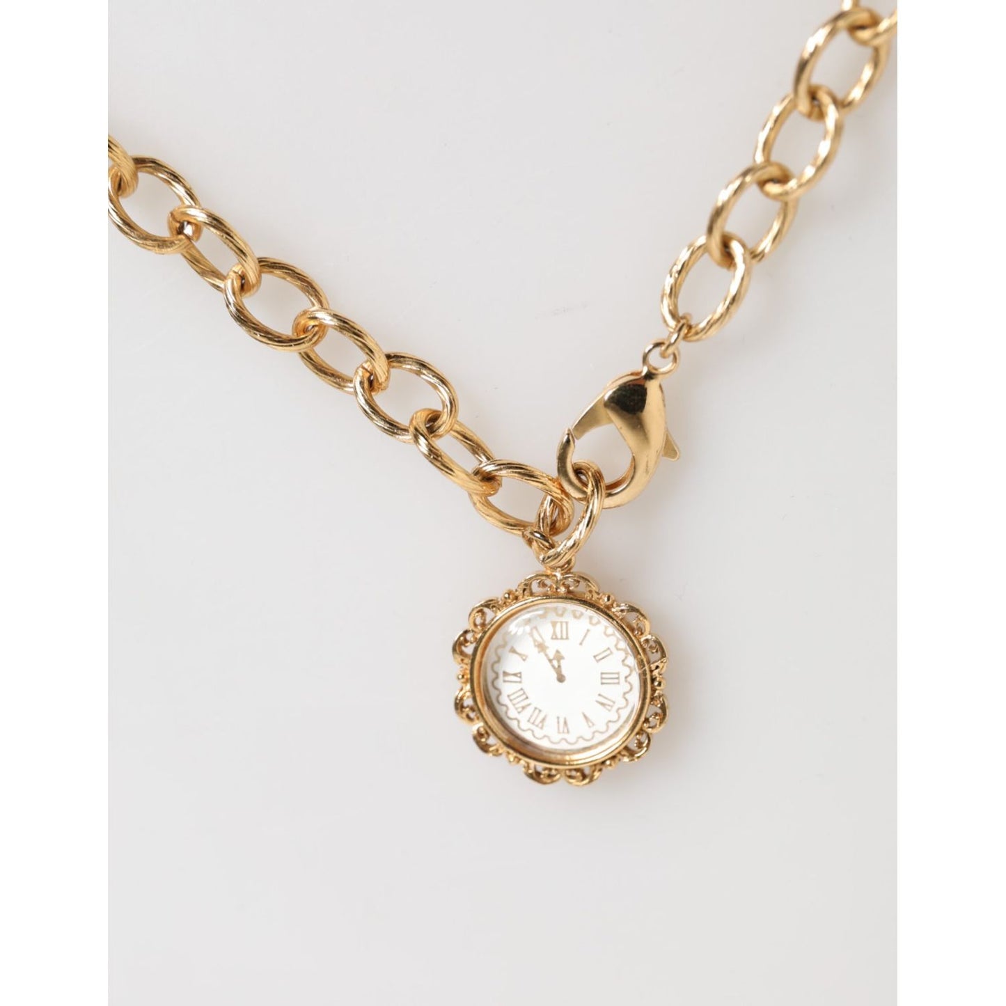 Dolce & Gabbana Gold Crystal Clock Face Pendant Statement Jewelry Necklace with gold-tone chain and rhinestone accents.