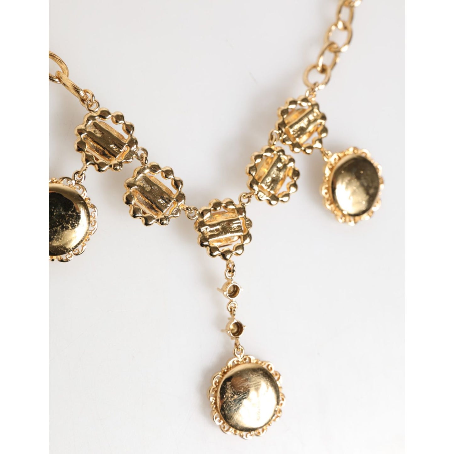 Dolce & Gabbana Gold Crystal Clock Face Pendant Statement Jewelry Necklace with vintage-inspired design and rhinestone accents.