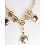 Dolce & Gabbana Gold Crystal Clock Face Pendant Statement Jewelry Necklace with vintage-inspired design and rhinestone accents.