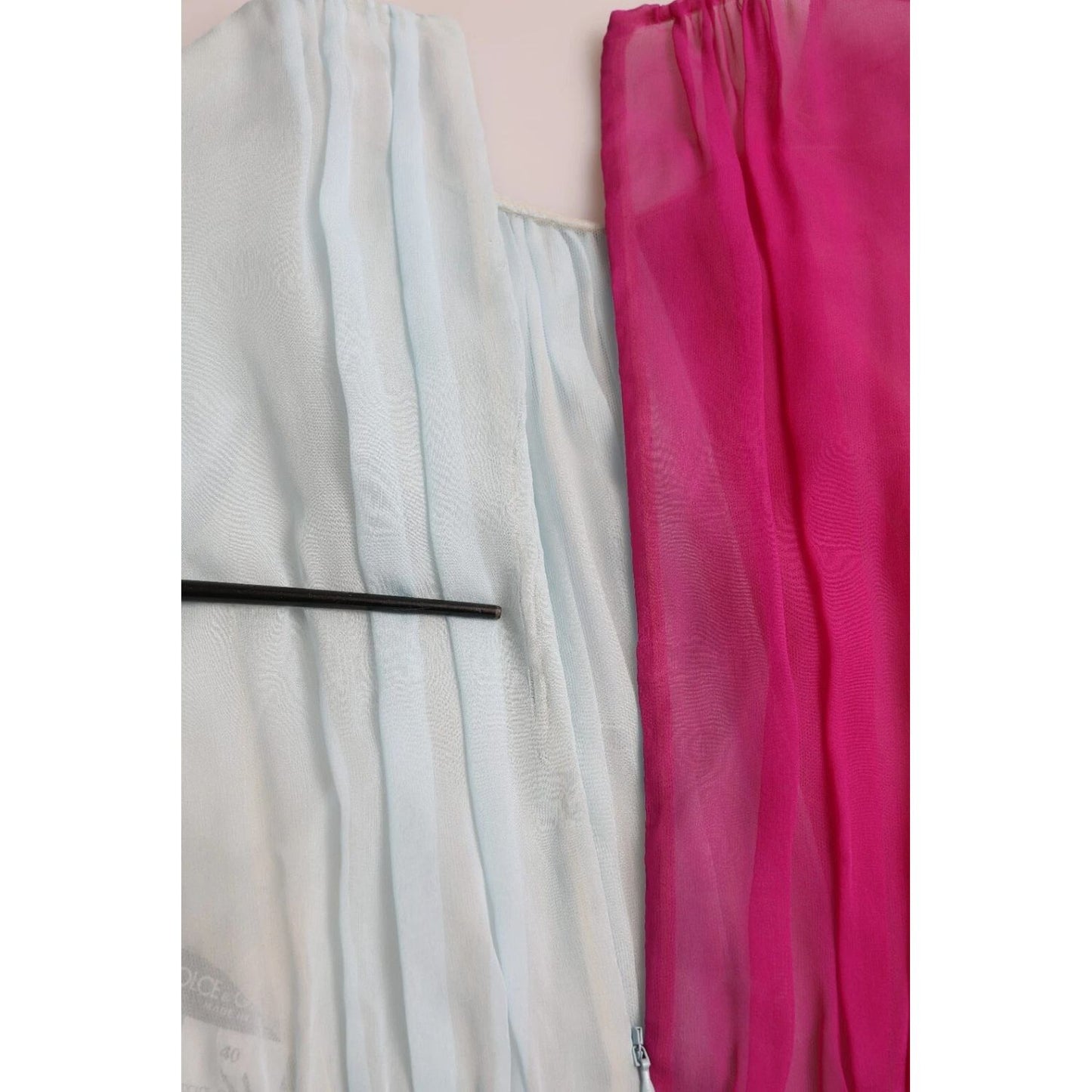 Close-up of Dolce & Gabbana Light Blue Silk Two Tone Midi Dress showing fuchsia and light blue silk fabric.