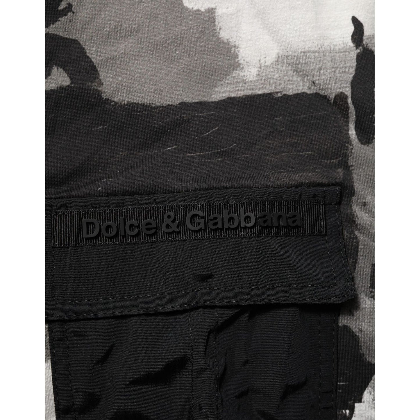Close-up of Dolce & Gabbana logo on Multicolor Camouflage Men Short Sleeves T-shirt, showcasing black patch detail.