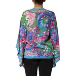 Dolce & Gabbana Multicolor Floral Printed Tunic Blouse Top with vibrant design, lightweight fabric, and elegant relaxed silhouette.