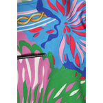 Close-up of Dolce & Gabbana Multicolor Floral Printed Tunic Blouse Top showcasing vibrant floral pattern and lightweight fabric.