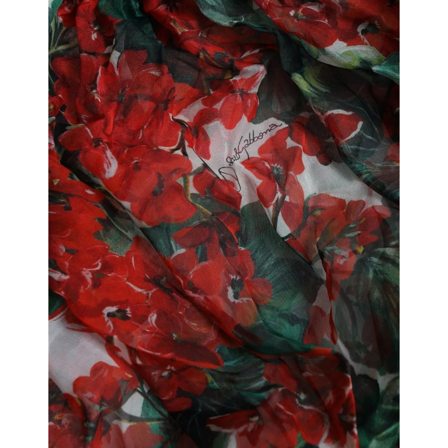 Dolce & Gabbana Multicolor Floral Silk Collar Blouse with red and green floral pattern on silk fabric, close-up view.