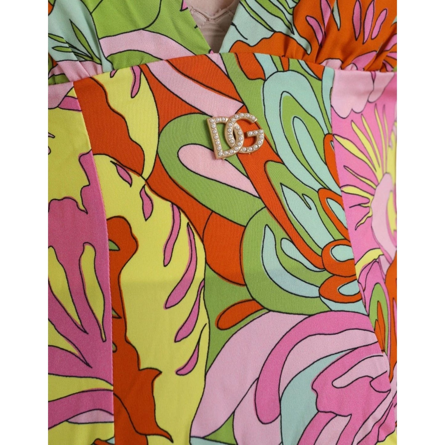 Close-up of Dolce & Gabbana Multicolor Floral Silk Flared Mini Dress with vibrant patterns and logo detail