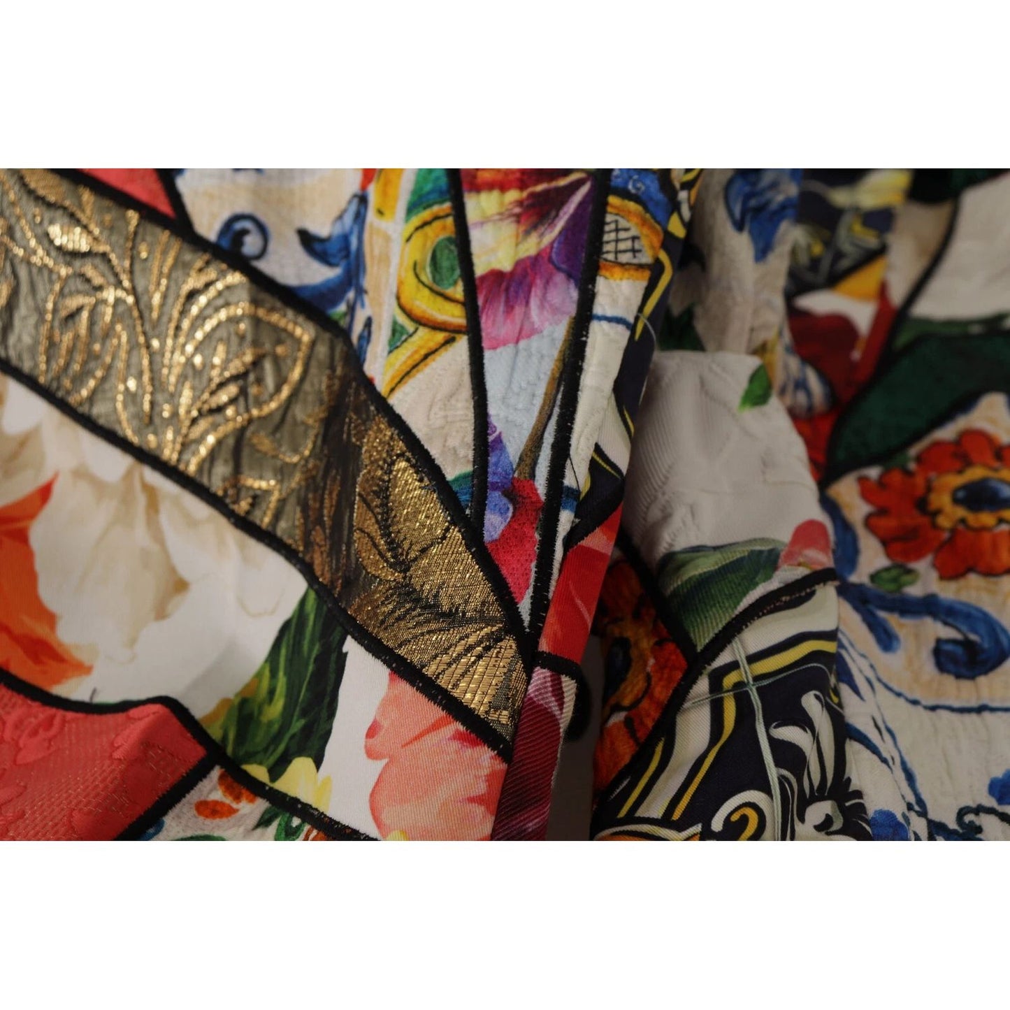 Close-up of Dolce & Gabbana Multicolor Patchwork Jacquard High Waist Pants fabric showing intricate floral and geometric designs.
