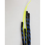 Black and yellow striped ropes with black tips on a neutral background.