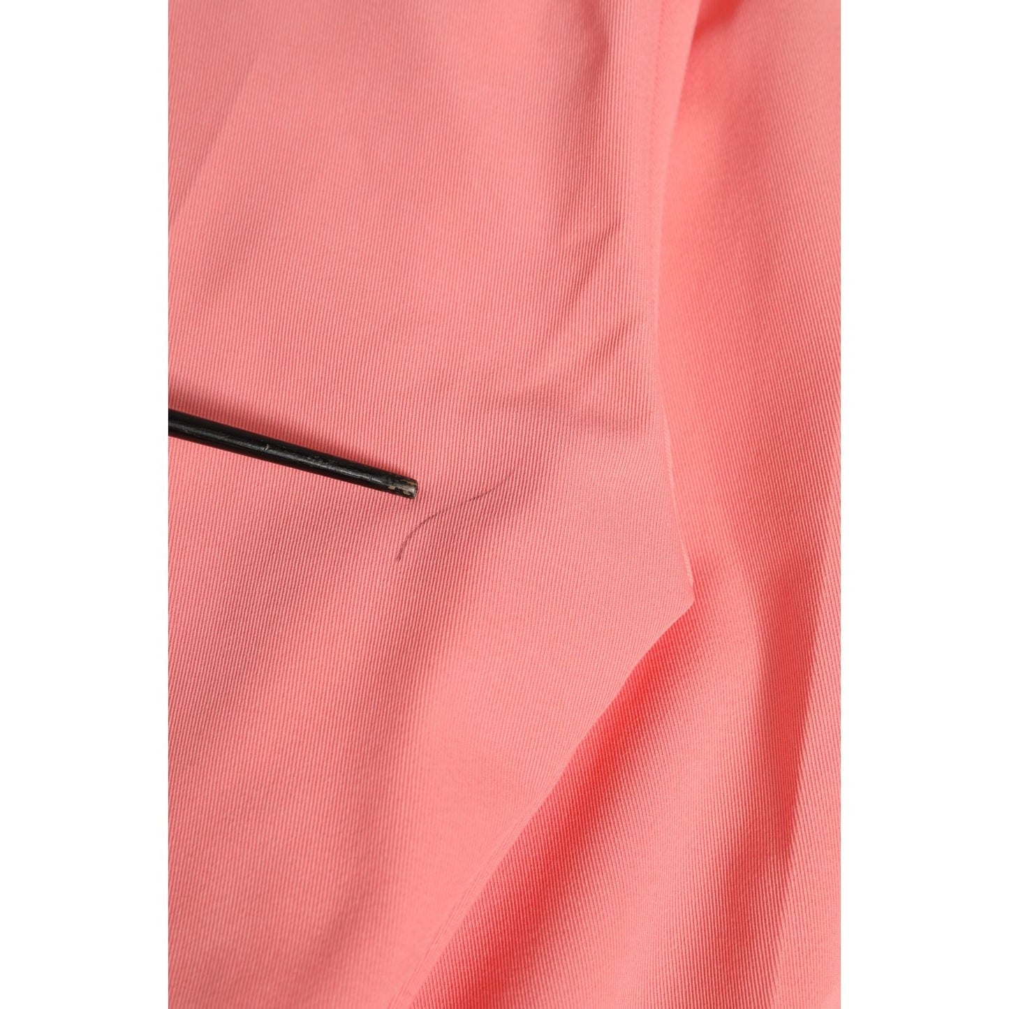 Close-up of Dolce & Gabbana Pink High Waist Dress Tapered Trouser Pants in soft pink fabric showing detail.