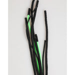 Black and neon green shoelaces on a light background