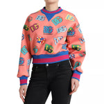 Dolce & Gabbana Salmon Pink Logo Print Sweatshirt Sweater; crew neck, long sleeves, colorful logos, exclusive Italian craftsmanship.
