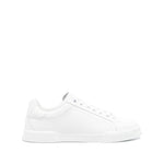 Dolce & Gabbana Sneakers White featuring lace-up fastening, round toe, and logo patch on a flat rubber sole.