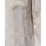 Close-up of Dolce & Gabbana White Silk DG Logo Print Long Sleeves Shirt showcasing the elegant logo pattern on luxurious fabric.