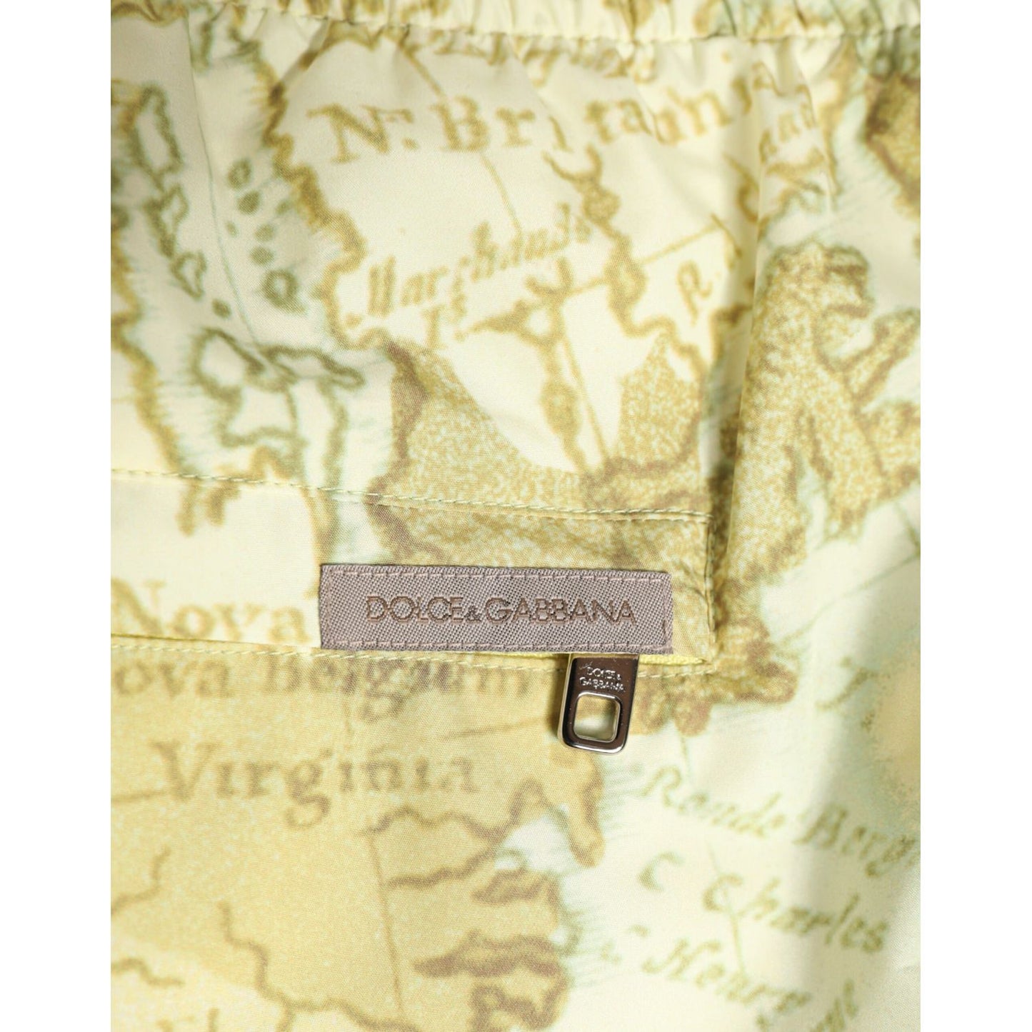 Dolce & Gabbana Yellow World Map Polyester Elastic Waistband Swimwear showcasing logo on printed material.