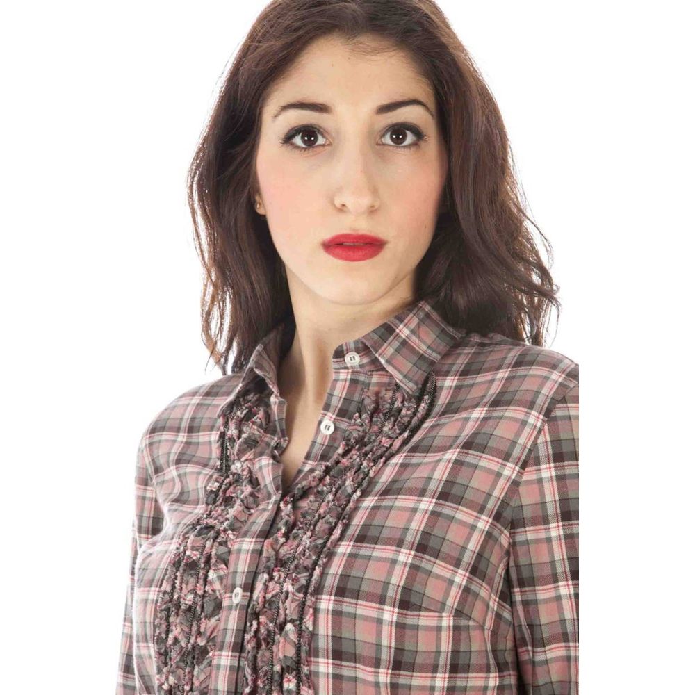 Woman wearing a plaid shirt with ruffles and buttons