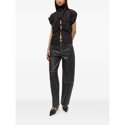 Alt Tag: Model wearing GANNI Jeans Black, featuring organic cotton denim, front button fastening, and classic five pockets design.