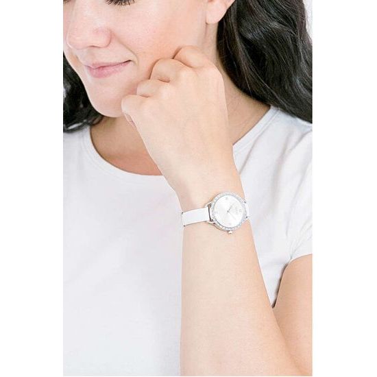 Woman wearing GUESS Mod. GW0099L1 women's watch, quartz analog, 30 mm silver case, white strap, displayed on wrist.