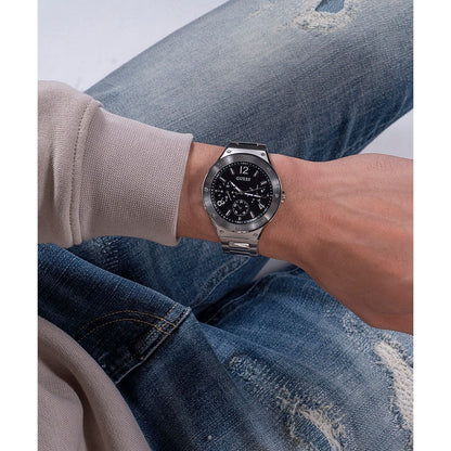 Gent wearing GUESS Mod. GW0454G1 watch with quartz analog movement and silver 925° case on wrist, showcasing 44mm dial.