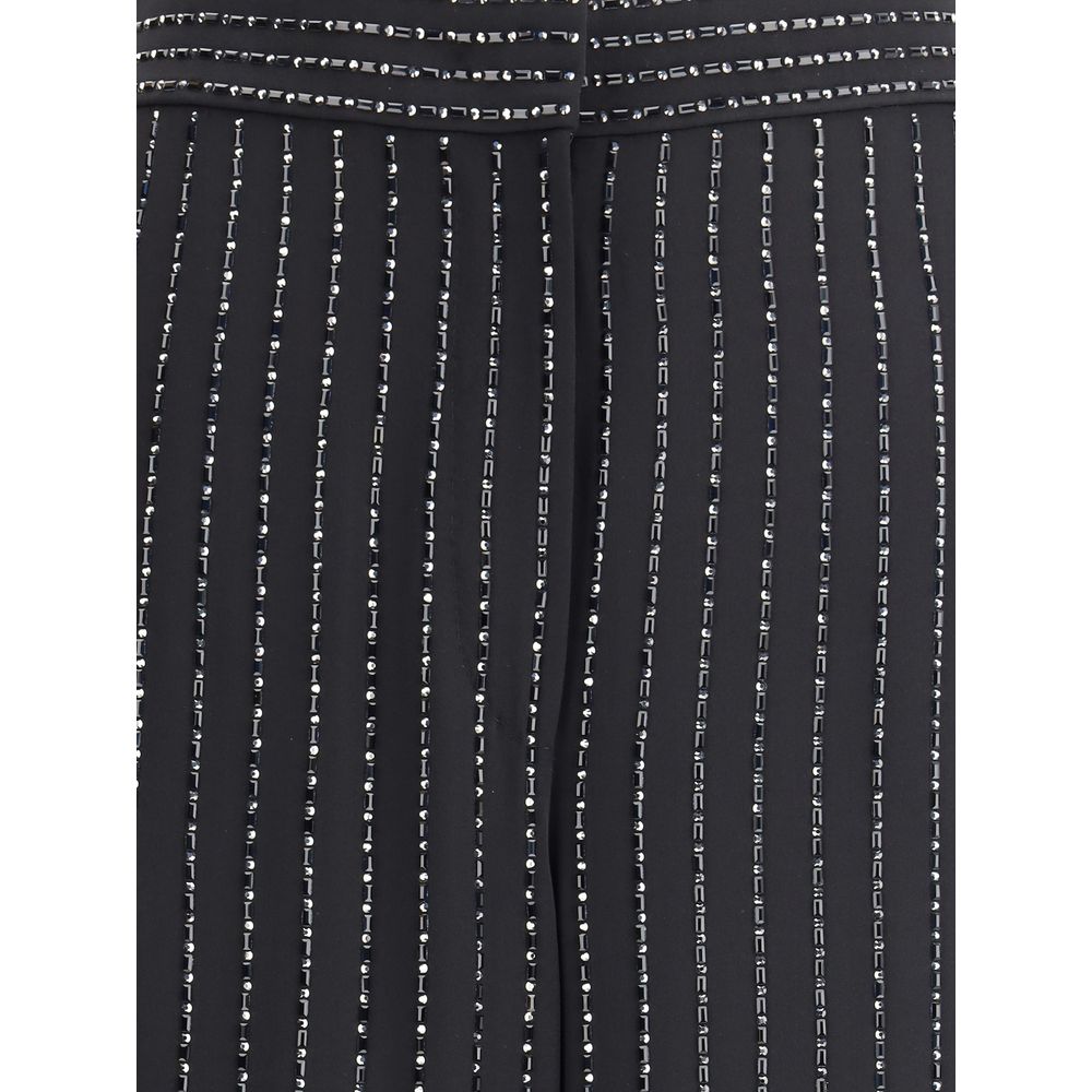 Close-up of Giorgio Armani Black Silk Casual Pants featuring embroidery and sequins on pinstripe pattern, showcasing elegance and sophistication.