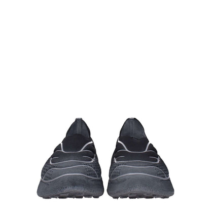 Givenchy Gray Fabric Athletic Sneakers with side logo, rubber sole, and round toe design, showcasing the stylish casual footwear.