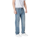 Man wearing Jack Jones Blue Cotton Relaxed Fit Jean with a casual T-shirt and sneakers, showcasing a comfortable and modern style.