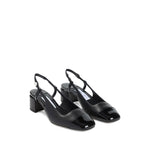 Jimmy Choo Elisa Sling Back 45 Patent and Nappa Leather Pumps with black slingback strap, pearl button, and contrasting toecap.