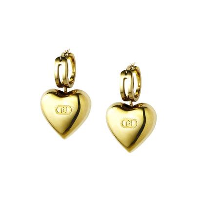 Gold heart-shaped hoop earrings with engraved initials, showcasing elegance and style for a sophisticated look.