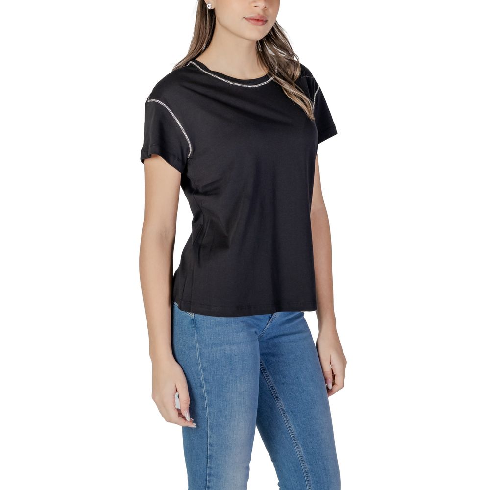 Woman wearing Liu Jo Black Cotton T-Shirt with contrasting stitching, straight cut and regular fit, paired with blue jeans.