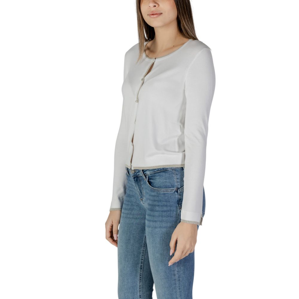 Woman wearing Liu Jo White Viscose Cardigan with long sleeves and button closure, paired with jeans, showcasing elegant fashion style.