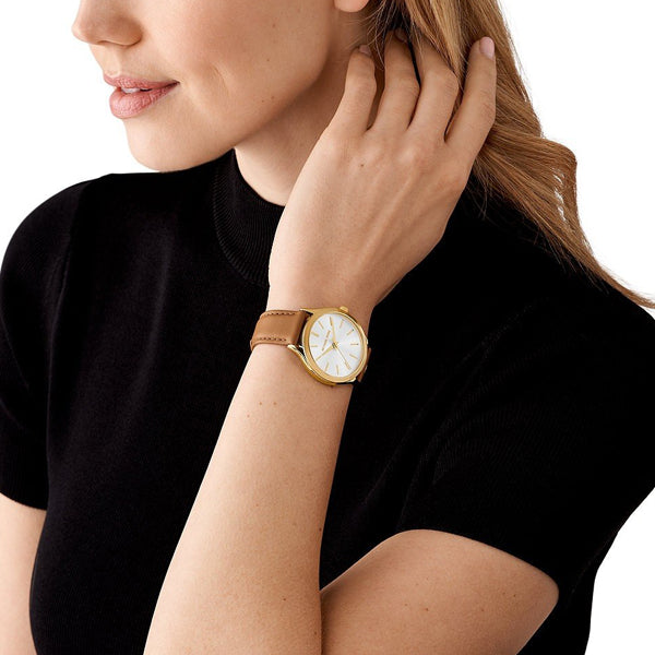 MICHAEL KORS WATCHES Mod. MK7465 on woman's wrist, 38mm lady's wristwatch with official packaging.