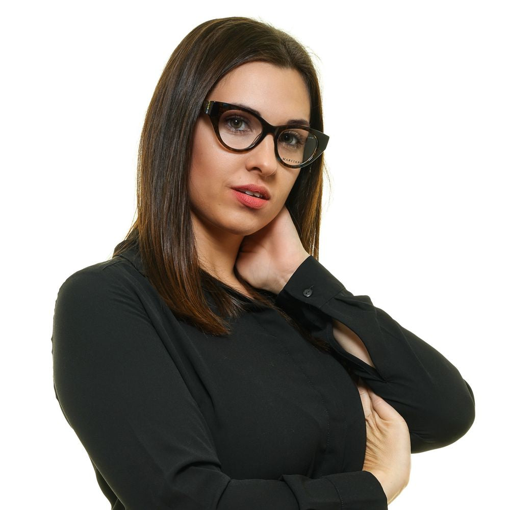 Woman wearing Marciano by Guess Brown Women Glasses Frame in cat eye style, featuring full-rim plastic frame, 49mm lenses, brown color.