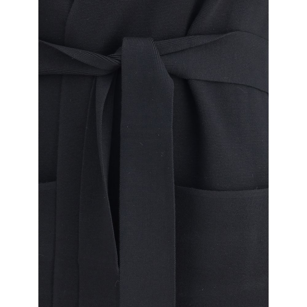 Close-up of Max Mara Black Viscose Coat highlighting the knotted removable sash and welt patch pockets for a refined touch.