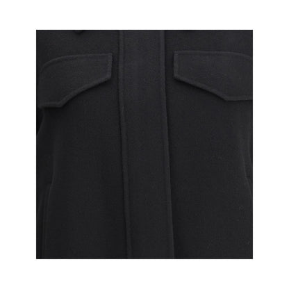 Close-up of Max Mara Black Wool Cloacks showing the contoured flap pockets and wool double drap texture.