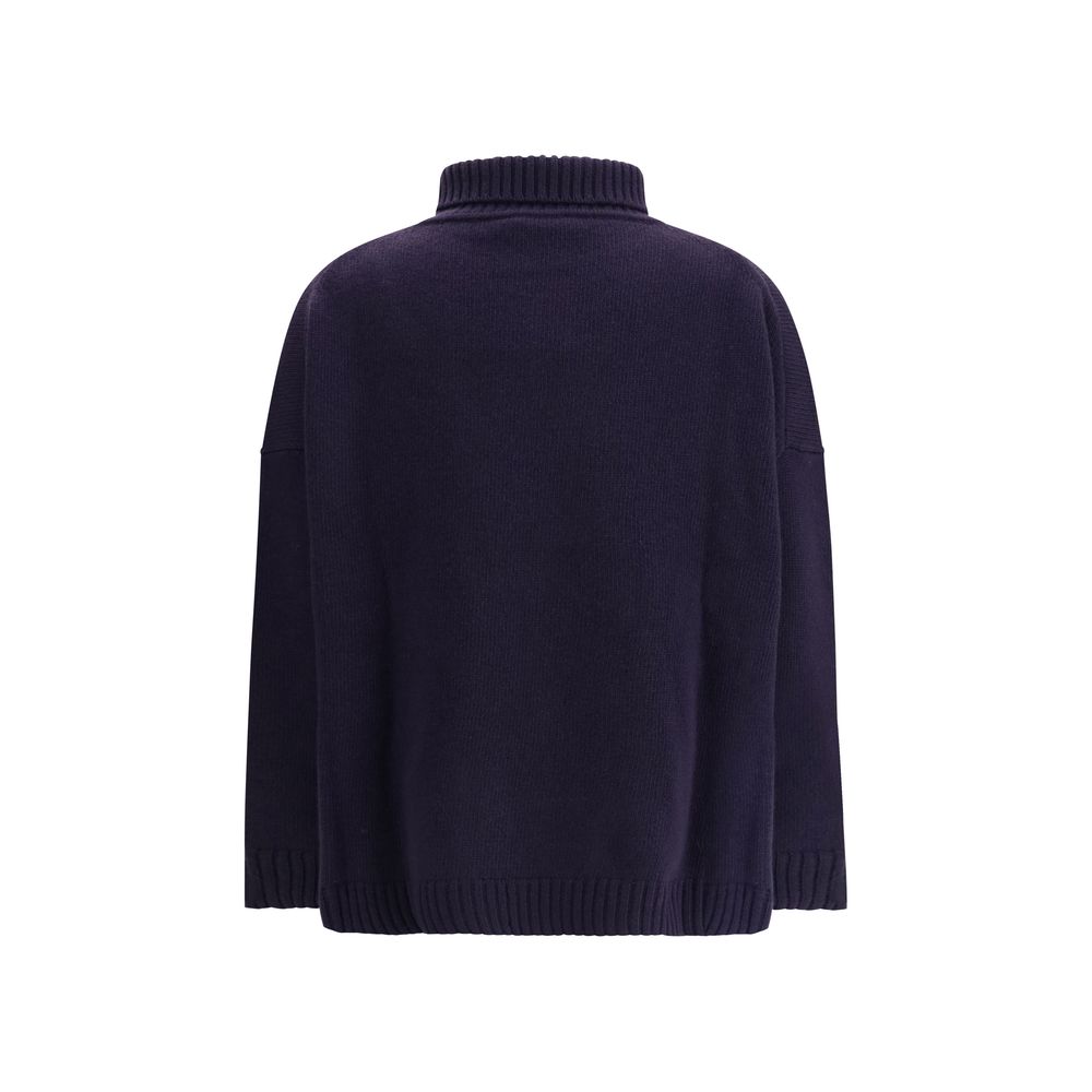 Back view of Max Mara Blue Fleece Wool Turtleneck with oversized fit and ribbed edges for a sophisticated winter look.