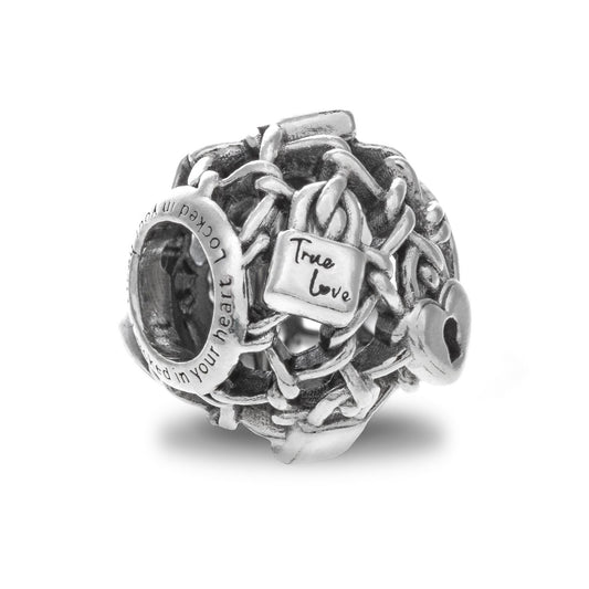 PANDORA Mod. 790071C00 silver charm featuring intricate design, "True Love" engraving, made in Thailand, 925° silver, in official box.
