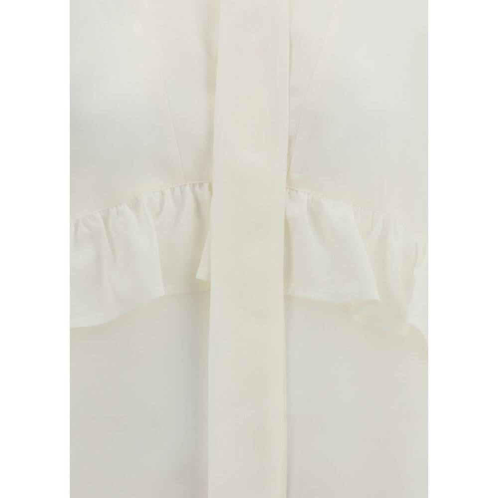Close-up of P.A.R.O.S.H. Cream Silk Blouse showcasing delicate ruffles and elegant design for a refined feminine look.
