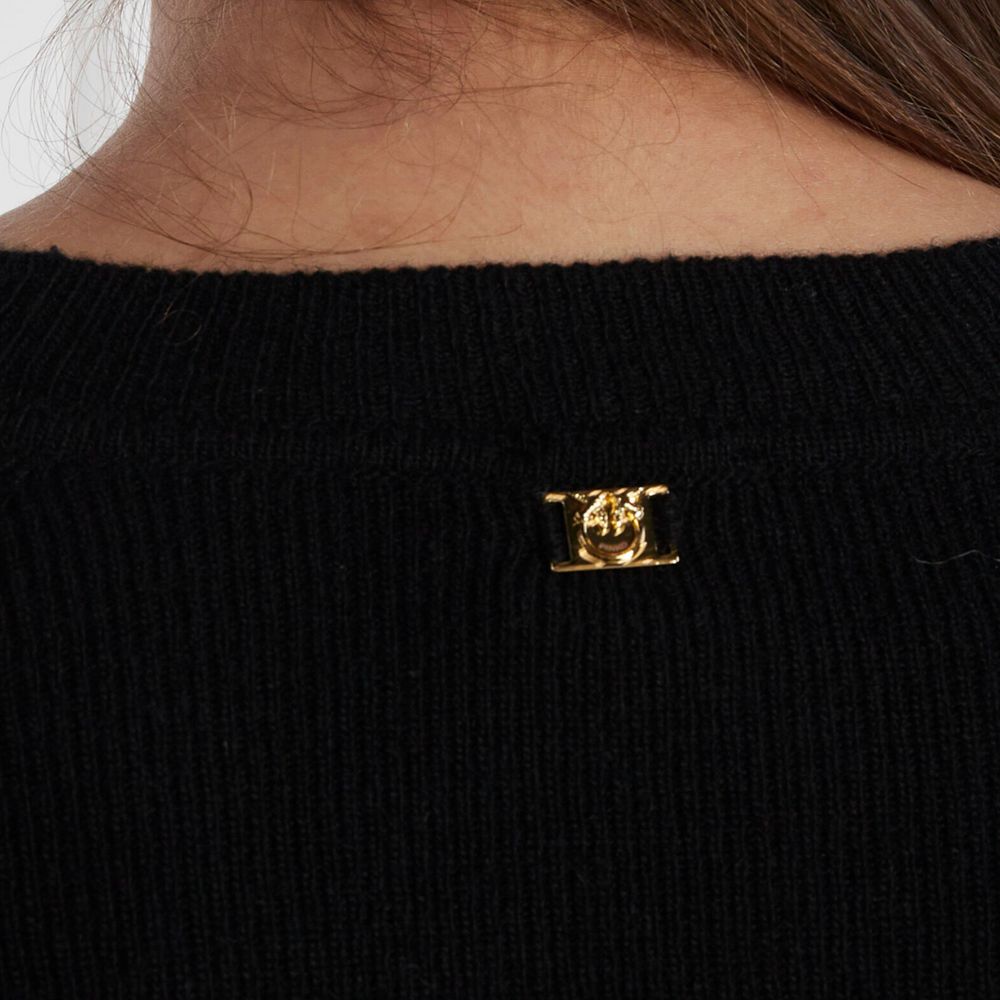 Close-up of metal logo detail on back of PINKO Black Wool Sweater showing crew neck style.
