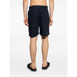 Back view of model wearing Paul Smith Shorts Blue, navy cotton knee-length with drawstring waistband, side pockets.