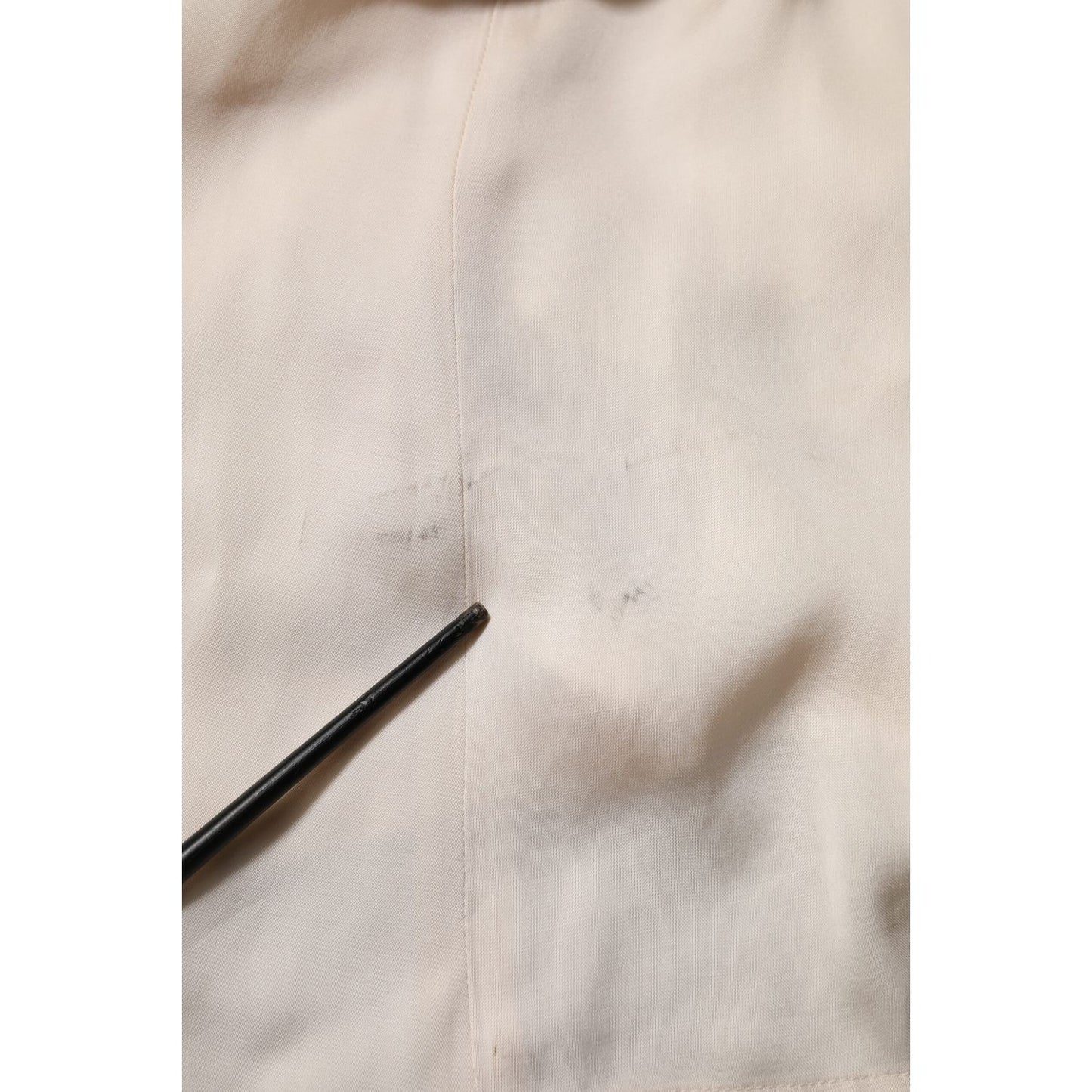 Close-up of Peserico Beige Viscose Pleated Sleeveless Long Maxi Dress fabric detail showing minor defect.