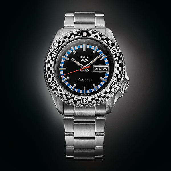 SEIKO 5 Mod. CHECKER FLAG AUTOMATIC LIMITED EDITION watch displaying time on dark background.