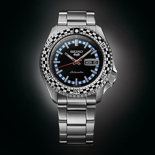 SEIKO 5 Mod. CHECKER FLAG AUTOMATIC LIMITED EDITION watch displaying time on dark background.
