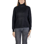 Woman wearing Sandro Ferrone Black Viscose Turtleneck sweater with ribbed design, long sleeves, and regular fit