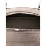 Interior view of grey Self-Portrait Suede mini shoulder bag, showing zip closure and brand logo inside main compartment.