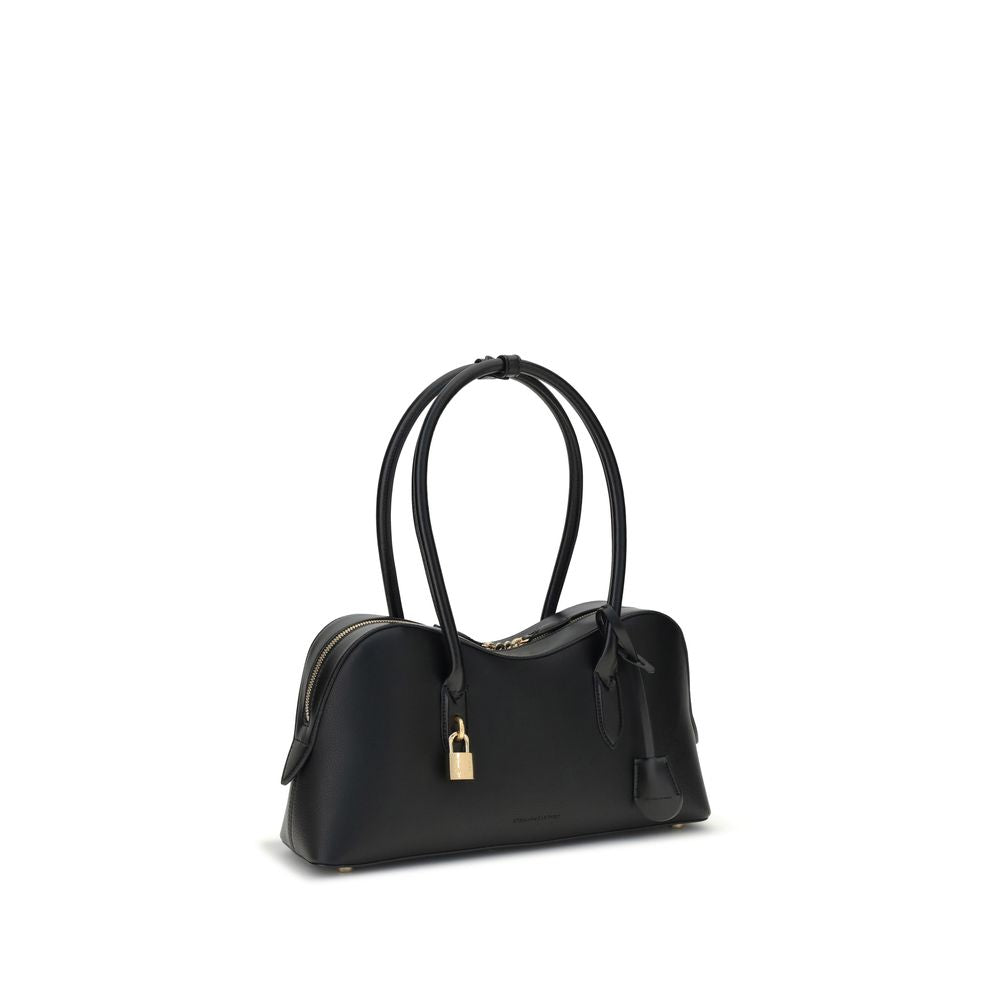 Stella McCartney Black Nylon Shoulder Bag with embossed logo and padlock, featuring two round handles and a zippered closure.