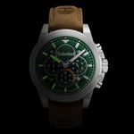 TIMBERLAND Mod. FAST STRIKE watch with brown leather strap and green dial on a black background.