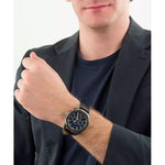 Person wearing TIMEX Mod. HARBORSIDE - COAST COLLECTION wristwatch with leather strap and stainless steel case.