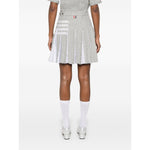 Back view of a grey Thom Browne Skirts Grey with frayed edges, signature 4-Bar stripe, and side button detailing.