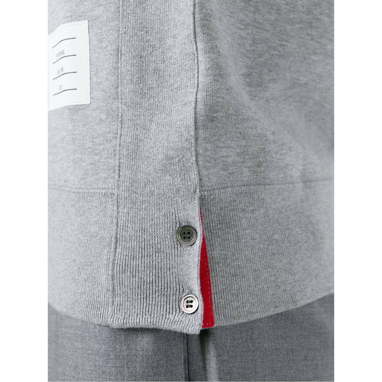 Close-up of Thom Browne Sweaters Grey 4-Bar cotton sweatshirt side button detail and name tag applique.