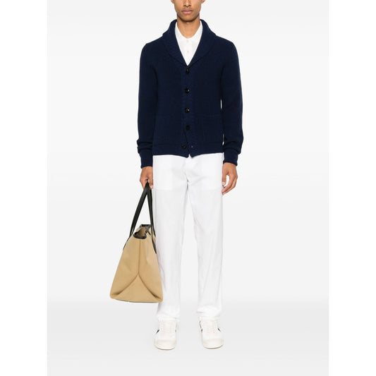 Model wearing Tom Ford T-shirts and Polos White, featuring white button placket, polo collar, and short sleeves. Ideal Lyocell piquet fashion.