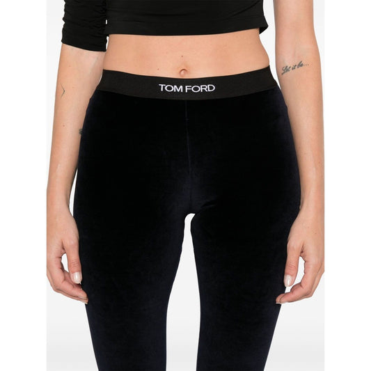 Woman wearing Tom Ford Trousers Blue, midnight velour high-waist leggings with logo waistband, styled for a sleek look.